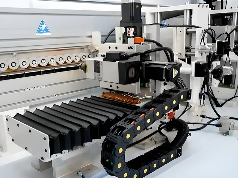 HE-668-SG-PUR integrated side drilling station using floating tracing technology to bore precise horizontal holes during the edge banding process.